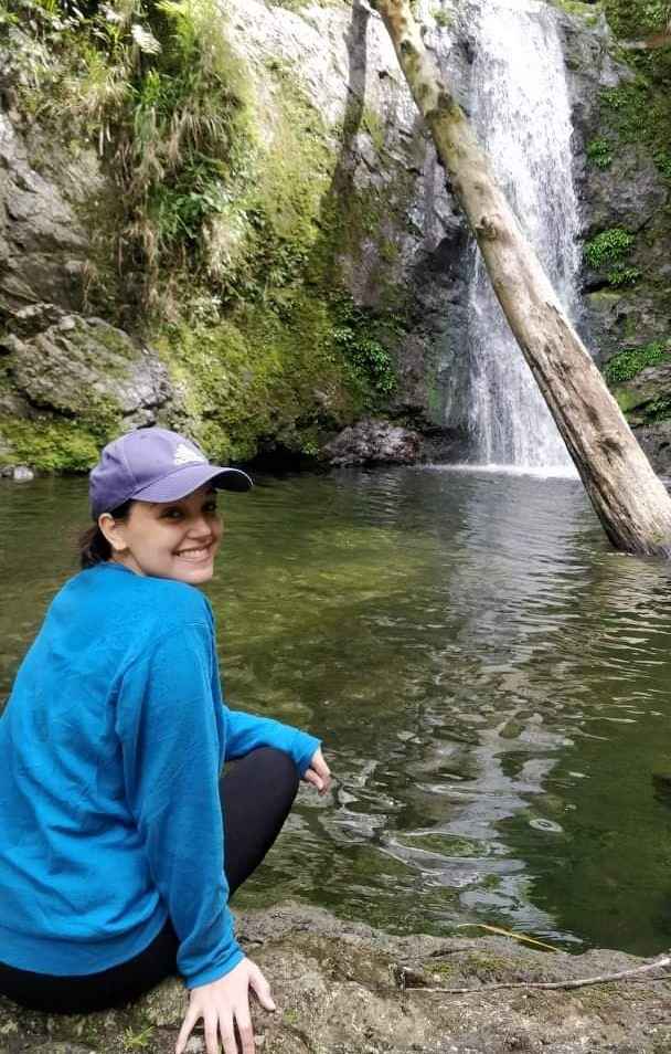 photo portrait of Thea Laorenza by a waterfall